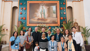 Archbishop José  H. Gomez poses with pilgrims inside the Sanctuary of the Fifth Guadalupan Apparition in Tulpetlac, Mexico, on July 12. (Isabel Cacho)