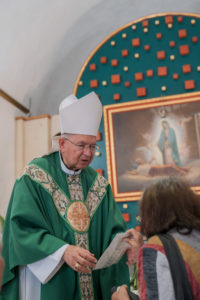 Archbishop José  H. Gomez blesses a pilgrim's rosary inside the Sanctuary of the Fifth Guadalupan Apparition in Tulpetlac, Mexico, on July 12. (Isabel Cacho)