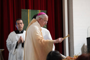 Archbishop José H. Gomez blesses catechist pins during the Welcome Back Mass on Aug. 5 at Cantwell-Sacred Heart of Mary High School in Montebello. (Poncho Romero)