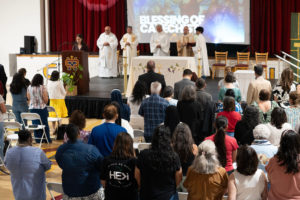Educators who completed their catechist certification receive a blessing during the Welcome Back Mass on Aug. 5 at Cantwell-Sacred Heart of Mary High School in Montebello. (Poncho Romero)