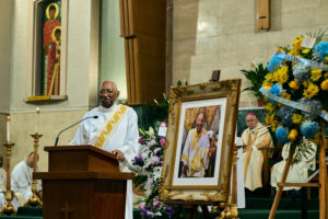 Deacon Peat Wilson speaks at Alexander’s funeral Mass at Holy of Name of Jesus Church Aug. 14. The two were friends over decades. (John Geronilla)