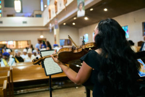 The choir and band perform during the Aug. 14 funeral Mass for Deacon Hosea Alexander at Holy Name of Jesus Church in Los Angeles. (John Geronilla)