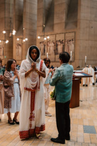Attendees dressed in cultural, ethnic, and religious clothing participate in the 