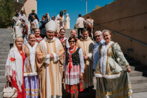 Auxiliary Bishop Slawomir Szkredk poses with the faithful who attended the 