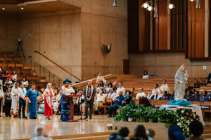 Attendees dressed in cultural, ethnic, and religious clothing participate in the 