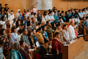 Attendees dressed in cultural, ethnic, and religious clothing participate in the 