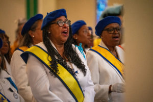 Attendees pray during the Sept. 6 Mass of Thanksgiving at Transfiguration Church for Greg Warner Sr.’s election as supreme navigator of the national Knights of Peter Claver. (John Rueda)