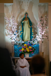 The Virgin Mary oversees the Sept. 6 Mass of Thanksgiving at Transfiguration Church for Greg Warner Sr.’s election as supreme navigator of the national Knights of Peter Claver. (John Rueda)