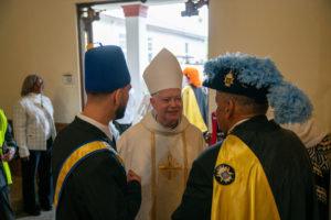 Auxiliary Bishop Matthew Elshoff speaks to attendees following the Sept. 6 Mass of Thanksgiving at Transfiguration Church for Greg Warner Sr.’s election as supreme navigator of the national Knights of Peter Claver. (John Rueda)