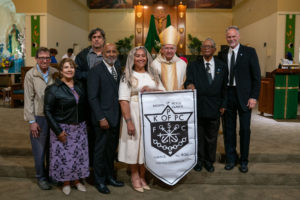 Archbishop José H. Gomez poses with members of Orange County's Knights of Peter Claver following the Sept. 6 Mass of Thanksgiving at Transfiguration Church for Greg Warner Sr.’s election as supreme navigator of the national Knights of Peter Claver. (John Rueda)