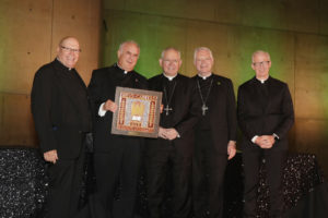 Father Vaughn Winters, second from left, holds his award after being honored at the 2026 St. John's Seminary Gala at the Cathedral of Our Lady of the Angels on Sept. 19. (Belle N’ Beau Photography)