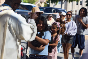 Father Chidi Ekpendu, pastor at St. Francis of Assisi Church in Silver Lake, celebrates the parish patron’s feast day with a special “Blessing of the Animals” after a special Mass and parish potluck on Oct. 4. (John Geronilla)