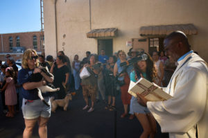 Father Chidi Ekpendu, pastor at St. Francis of Assisi Church in Silver Lake, celebrates the parish patron’s feast day with a special “Blessing of the Animals” after a special Mass and parish potluck on Oct. 4. The blessing came after a weekend of special events marking the 800th anniversary of St. Francis’ death in 1226. (John Geronilla)